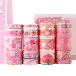 Detail of 16-roll pink Sakura washi tape set with gold foil patterns and floral designs