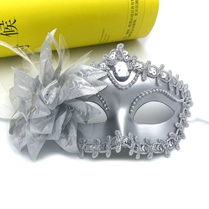 Silver Venetian masquerade mask with a large grey mesh flower and rhinestone jewel