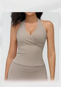 Detailed fit of V-neck halter yoga top on model showing matte fabric and slim silhouette