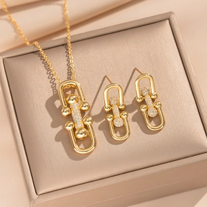 18K gold plated jewelry set with horseshoe link necklace and matching stud earrings