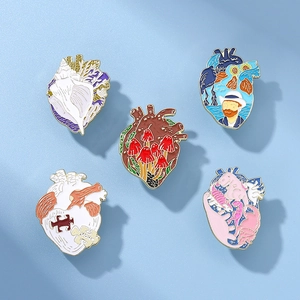Five anatomical heart enamel pins featuring oil painting styles and artistic patterns