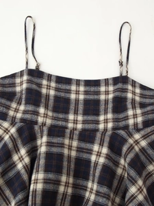 Detail of plaid camisole top featuring blue check pattern and adjustable shoulder straps