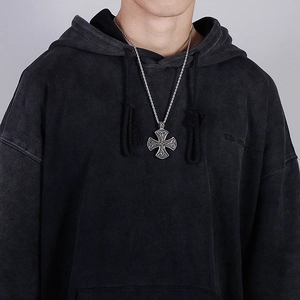 Vintage Celtic cross pendant necklace in silver stainless steel worn by a male model
