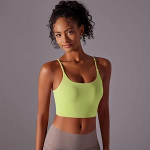 Detail of neon yellow high-impact sports bra featuring thin straps and U-neckline design