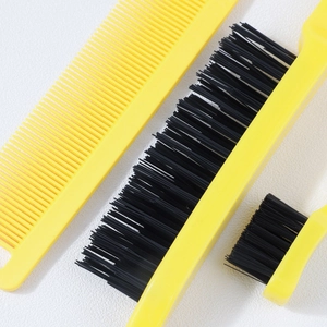 Close-up of vibrant yellow hair styling tool set with black synthetic bristles