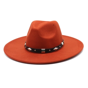 Detail of wide brim wool fedora hat with studded black leather band and metal accents