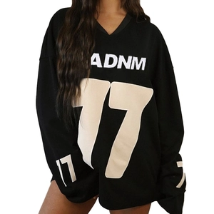 Close-up of black oversized jersey sweatshirt with ADNM print and number 17 detailing