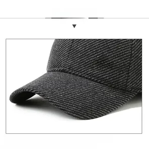 Detailed macro view of dark grey twill winter baseball cap with metal S Sport logo