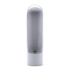 Vertical view of a transparent herb saver pod with a white base for fresh vegetable storage