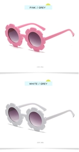 Detail view of pink and white sunflower sunglasses with side frame show for children