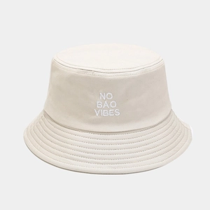 Beige cotton bucket hat with NO BAO VIBES embroidery and stitched brim for sun protection