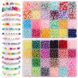 Detail view of colorful glass crystal beads and 7-grid storage box for DIY nail art