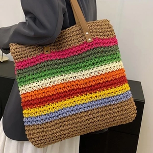 Handwoven rainbow straw tote bag with large capacity and brown leather handles for beach