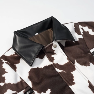 Winter tie-dye cow print jacket with black faux leather collar and metallic snap buttons