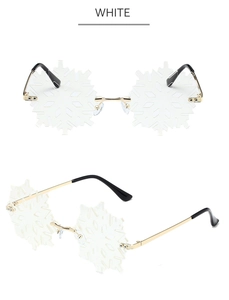 Detailed view of white snowflake rimless sunglasses with elegant gold metal temples