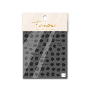 Close-up of black rose nail art stickers with Love text in transparent packaging