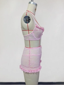 Side view of pink floral lace lingerie set with ruffled trim on a female mannequin