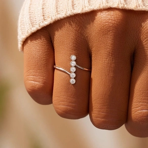 Elegant S925 sterling silver bypass ring with five aligned round cubic zirconia stones