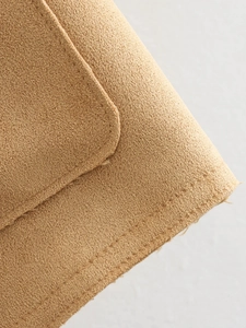 Detail of double-needle stitching and faux suede texture on khaki casual jacket
