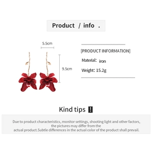 Detail view of deep red orchid earrings with iron material specs and dimensions