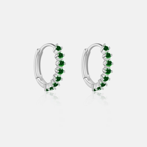 Detailed close-up of S925 silver hoop earrings featuring pavé-set green cubic zirconia stones