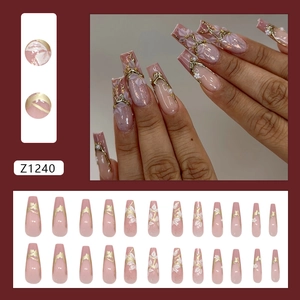 French magnolia pearl press-on nails with 3D gold accents and purple marble design