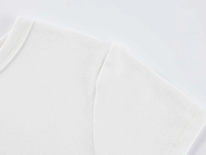 Close-up of white modal t-shirt ribbed neckline and professional shoulder stitching detail