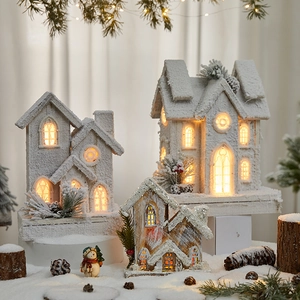 Lighted wooden Christmas house set with snow texture and LED glow for festive decor