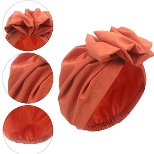 Fashionable caramel turban hat for women with large bow and pleated fabric texture