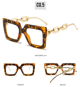 Detail of oversized tortoiseshell frames with signature golden chain temple design