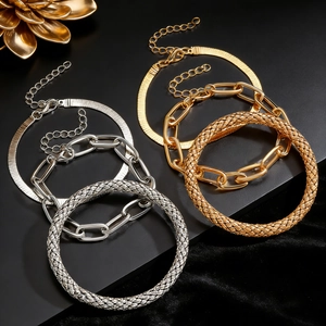 Detailed set of gold and silver boho alloy bracelets with sleek snake chains and textures