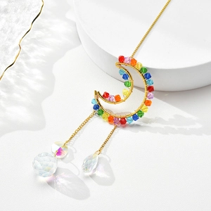 Celestial K9 crystal suncatcher with golden moon frame and rainbow prism light effects
