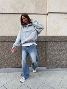 Women's gray half-zip oversized sweatshirt with embroidery and blue wide-leg jeans