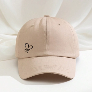 Classic khaki cotton baseball cap featuring a minimalist black double heart print design