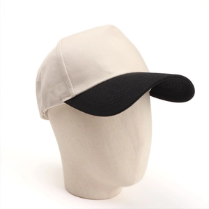 Detail of two-tone twill cotton baseball cap showing contrast brim and precise stitching