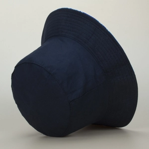 Detail view of reinforced stitching on brim of dark blue camouflage bucket hat