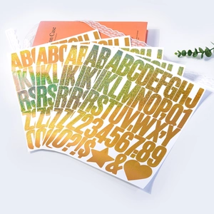Close-up of holographic glitter alphabet and number stickers for DIY crafts and gifts