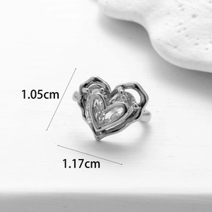 Detail view of heart-shaped earring showing dimensions 1.05cm and 1.17cm with zircons
