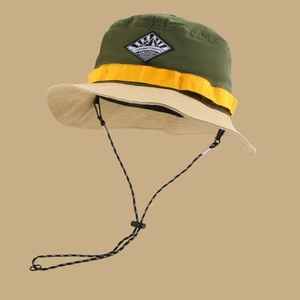 Three-tone color block outdoor fisherman hat with adjustable drawstring and mountain patch
