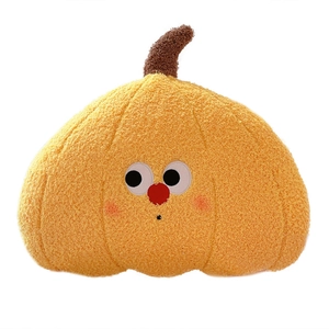 Plush pumpkin throw pillow in orange sherpa fabric with a cute cartoon face