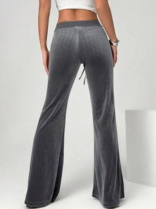 Women's dark gray velvet flared pants featuring a high waist and drawstring detail from behind
