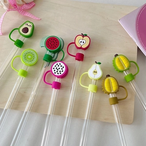 Close-up of 8 transparent straws with colorful silicone fruit dust caps on wood
