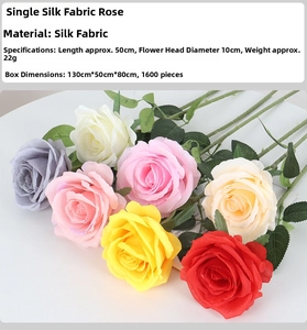 Close-up of artificial velvet roses in multiple colors showing size and fabric detail