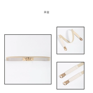 Detail of slim beige elastic belt for women with gold chain buckle and faux leather finish