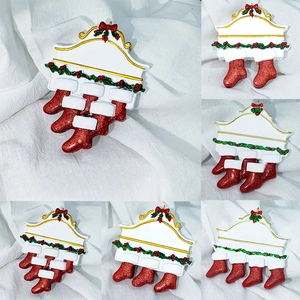 Detailed view of personalized resin Christmas fireplace pendants with 2 to 7 red stockings