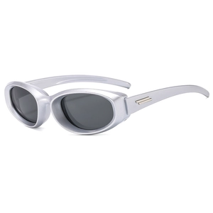 Futuristic silver Y2K sunglasses with dark lenses shown from a 45-degree angle