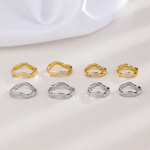 Sparkling wave-shaped earrings with inlaid zircons in gold and silver metal finishes