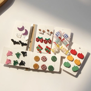 Glitter acrylic earring set featuring Halloween pumpkin ghosts and Christmas reindeer