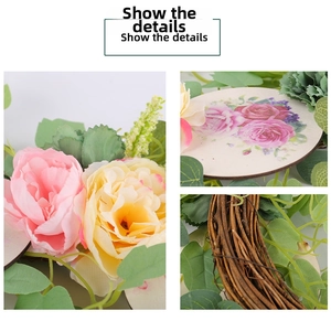 Detail of faux roses, lush greenery, and a floral printed plate on a natural rattan wreath