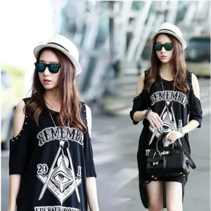 Detail of street style off-shoulder long T-shirt with mystic graphic and metal studs